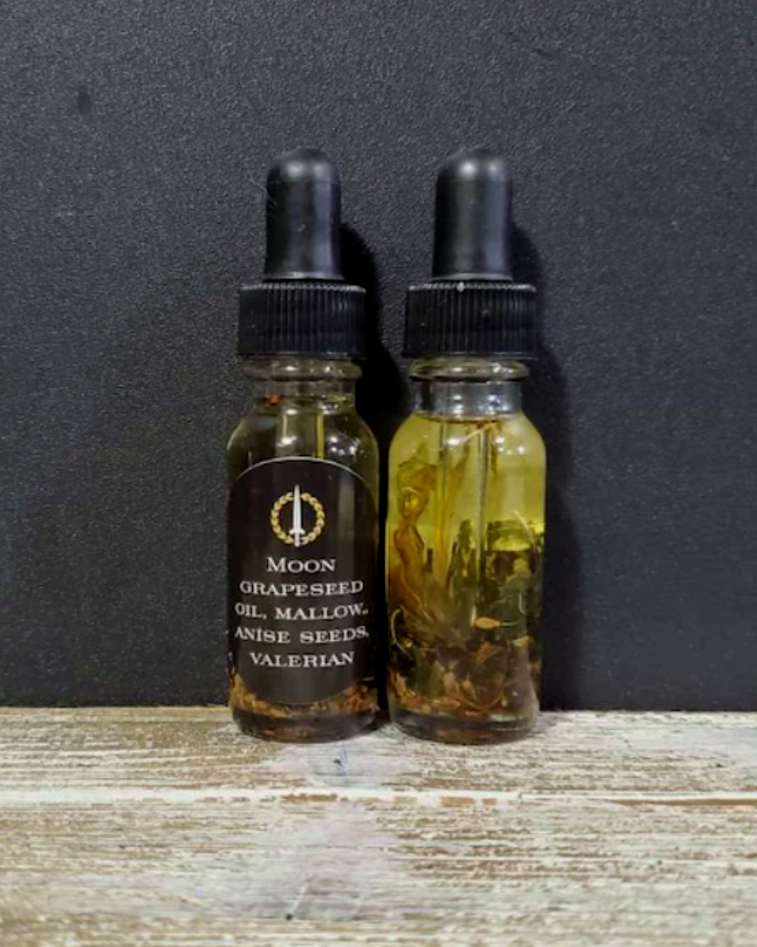 A bottle of ritual oil infused with herbs. For use in planetary magic and witchcraft. 
